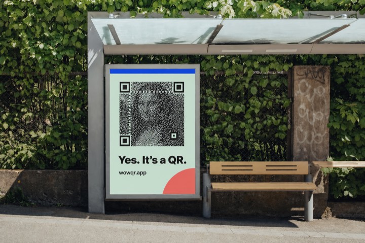 Bus shelter poster beside a hedge